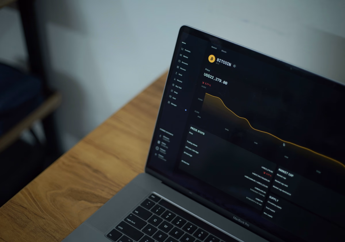 A laptop showing a dark analytics dashboard